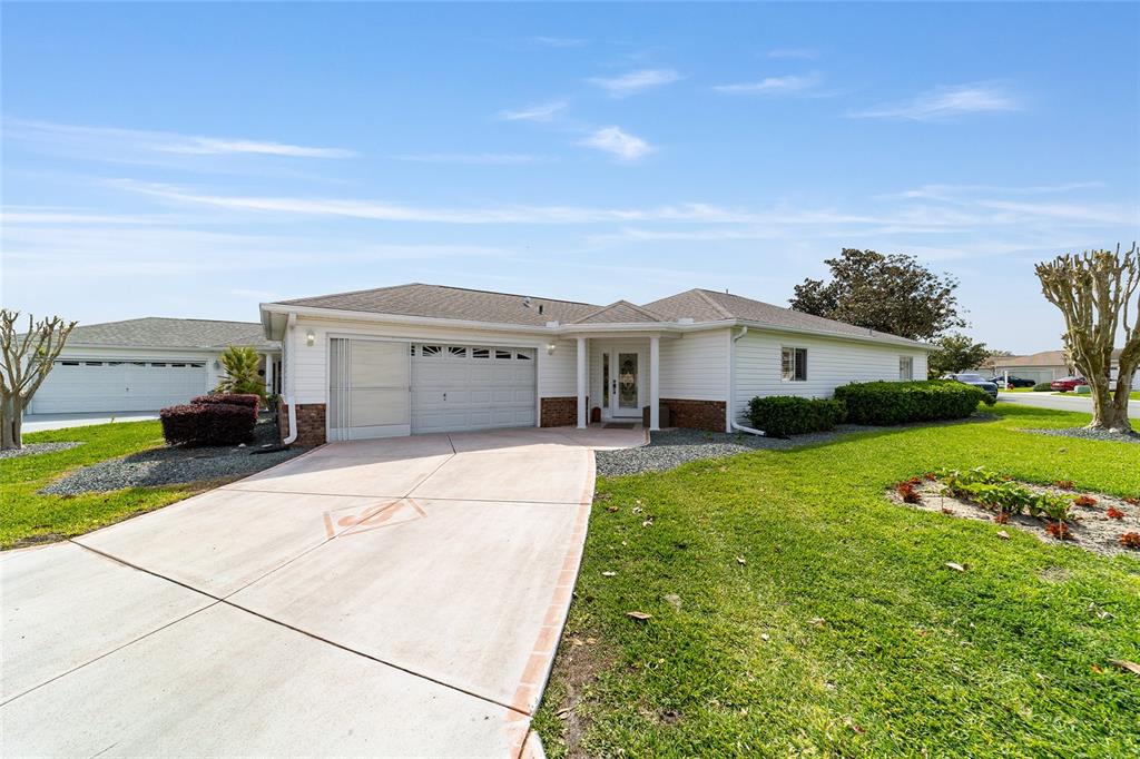 8608 Southeast 141st Street Road Summerfield, FL 34491 - Photo 64 of 82 a front view of a house with a yard