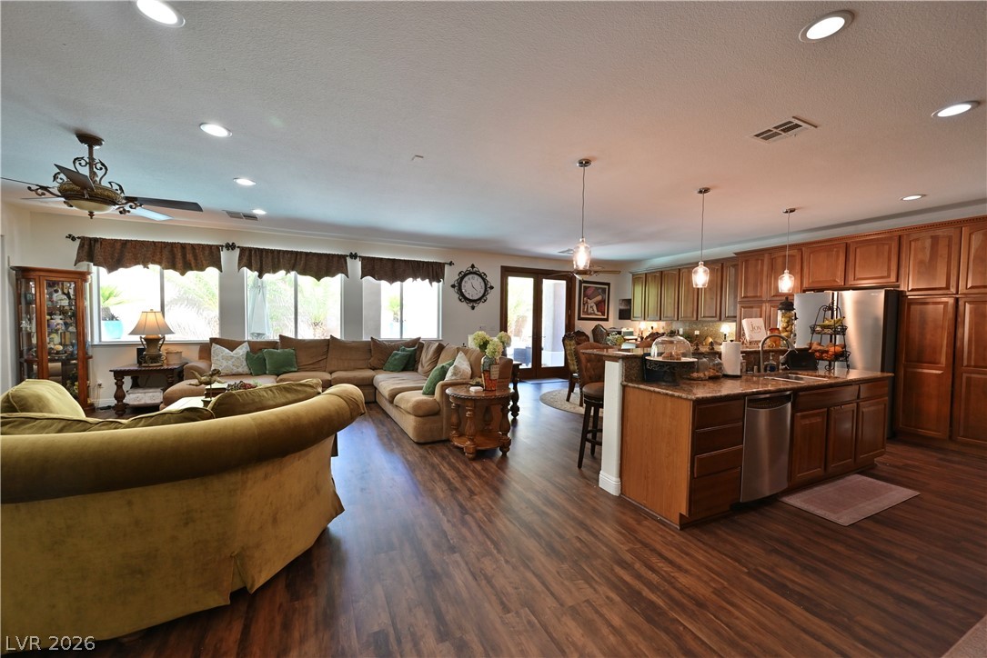 2729 Kildrummie Street Henderson, NV 89044 - Photo 42 of 42 An open floorplan seamlessly connects the well-appointed kitchen and comfortable living area.