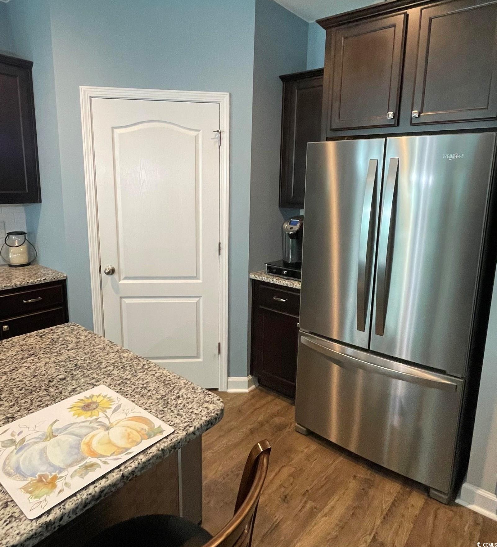 342 Dunbarton Lane Conway, SC 29526 - Photo 6 of 37 Kitchen with light stone countertops, dark brown c
