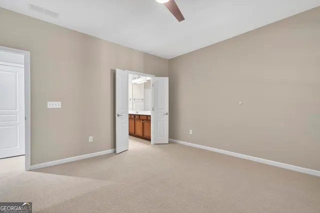 an empty room with closet area