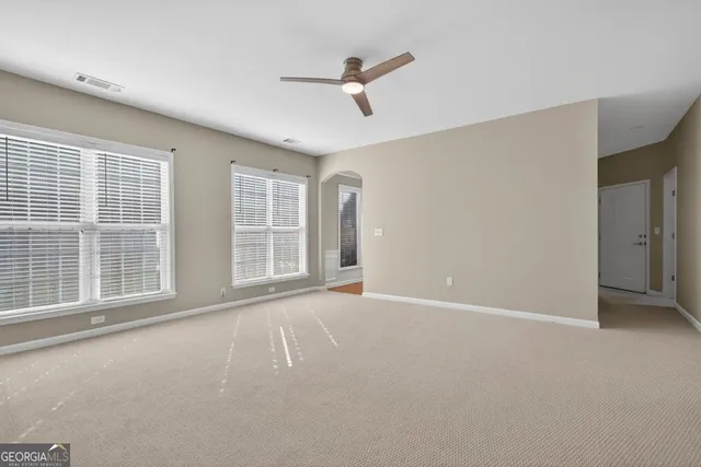 a view of an empty room with a window