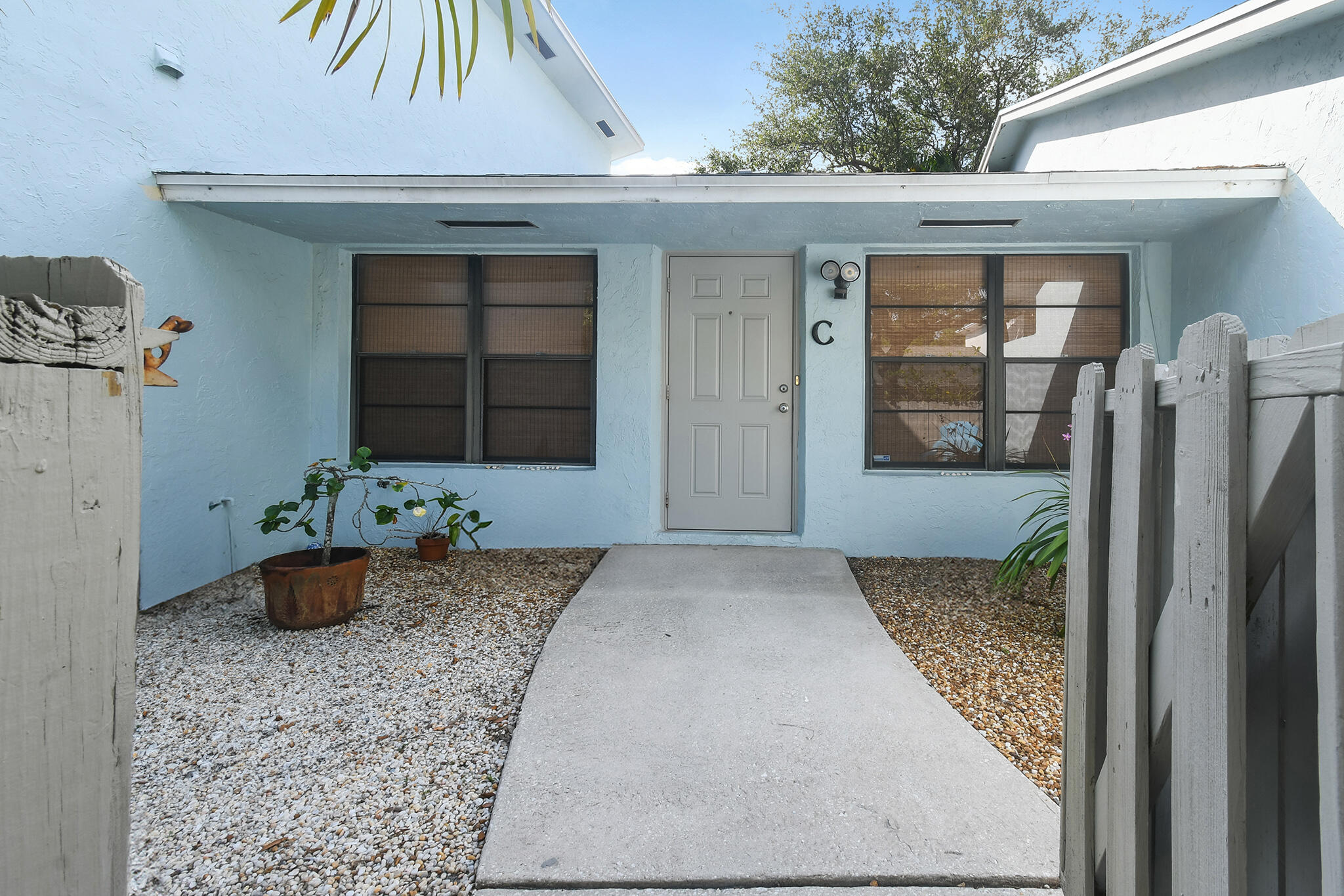 431 Jupiter Lakes Boulevard, Unit 2113C Jupiter, FL 33458 - Photo 1 of 21 a front view of a house