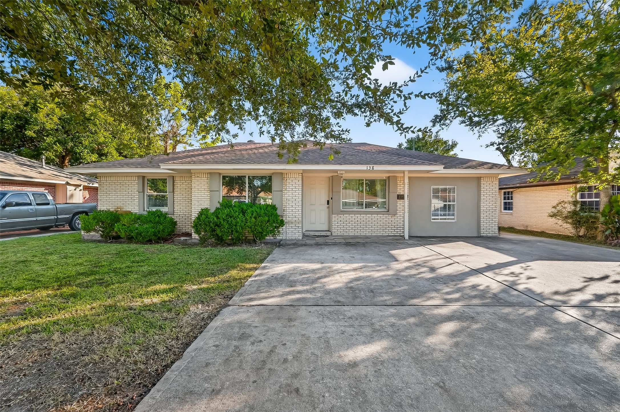 138 East Rocky Creek Road Houston, TX 77076 - Photo 1 of 13 a view of a house with a yard and large tree