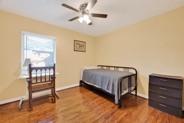 a living room with a bed furniture and a window