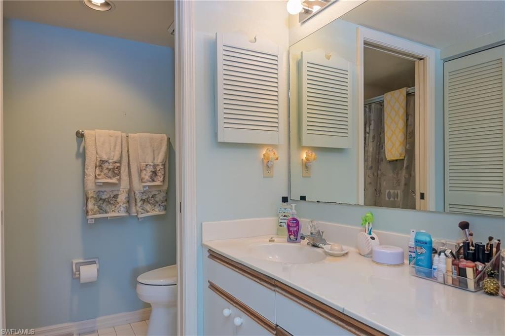4121 Lorene Drive, Unit 207 Estero, FL 33928 - Photo 15 of 34 a bathroom with a sink and a mirror