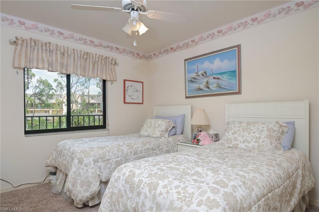 4121 Lorene Drive, Unit 207 Estero, FL 33928 - Photo 17 of 34 a bedroom with a bed and a painting on the wall