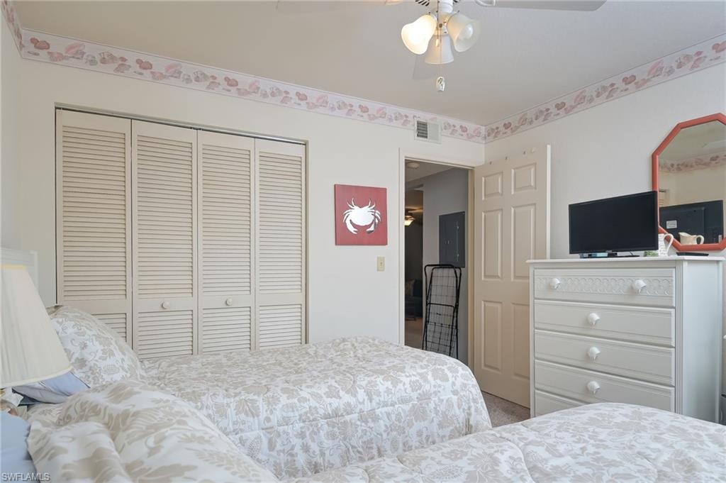 4121 Lorene Drive, Unit 207 Estero, FL 33928 - Photo 18 of 34 a bedroom with a bed and a flat screen tv