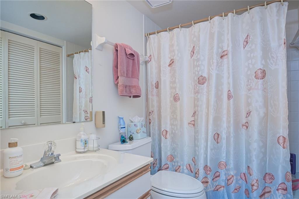 4121 Lorene Drive, Unit 207 Estero, FL 33928 - Photo 19 of 34 a bathroom with a sink toilet and shower