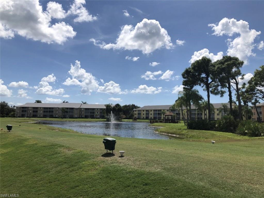 4121 Lorene Drive, Unit 207 Estero, FL 33928 - Photo 24 of 34 a view of a lake with a big yard