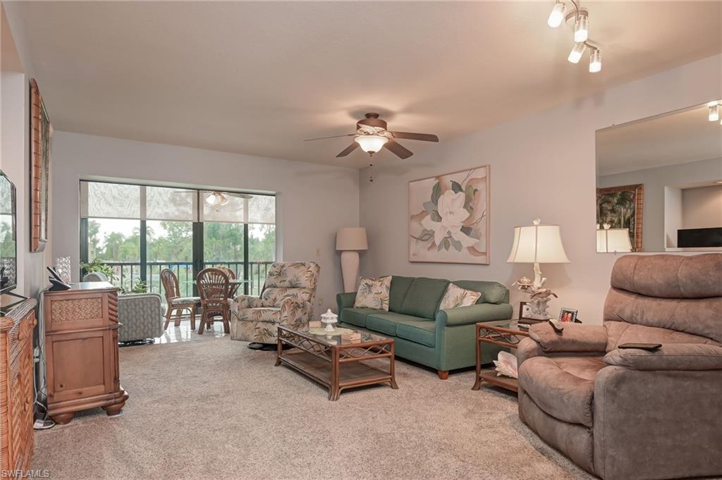 4121 Lorene Drive, Unit 207 Estero, FL 33928 - Photo 7 of 34 a living room with furniture and a large window