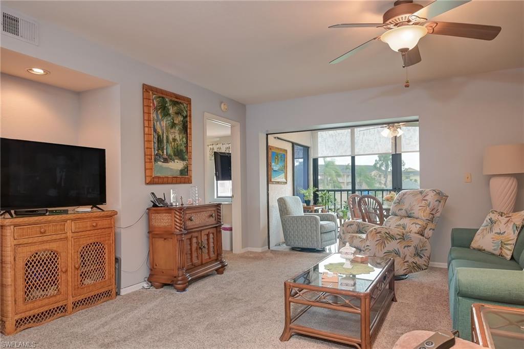 4121 Lorene Drive, Unit 207 Estero, FL 33928 - Photo 8 of 34 a living room with furniture and flat screen tv