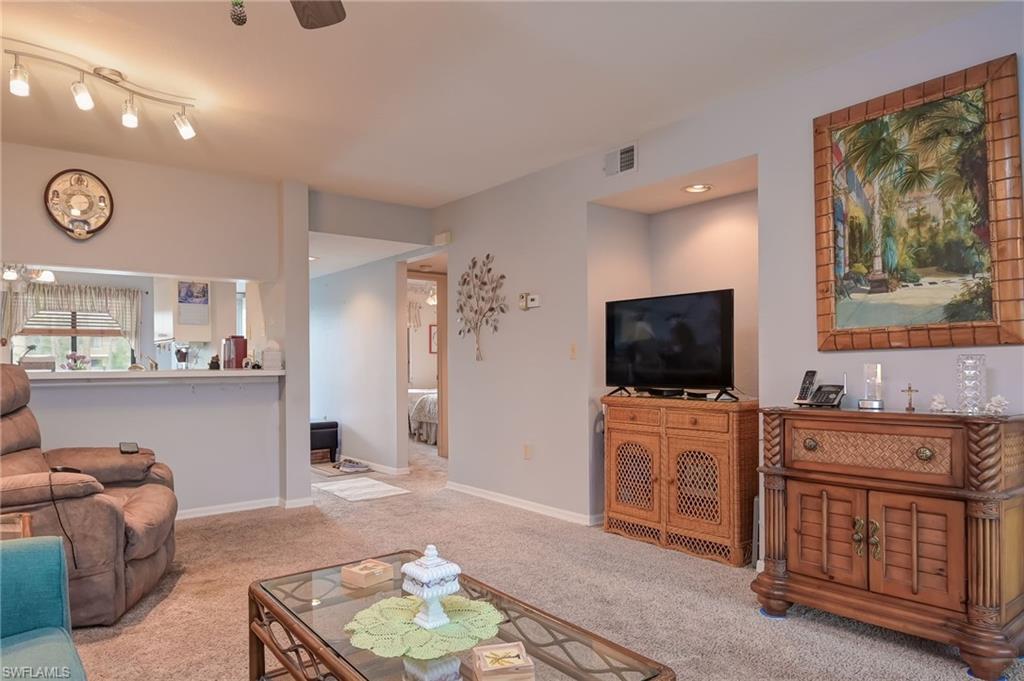 4121 Lorene Drive, Unit 207 Estero, FL 33928 - Photo 9 of 34 a living room with furniture and a flat screen tv