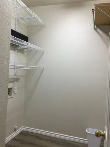 a view of small space with racks on the wall