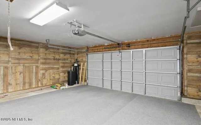 a view of an empty room with a empty space and windows