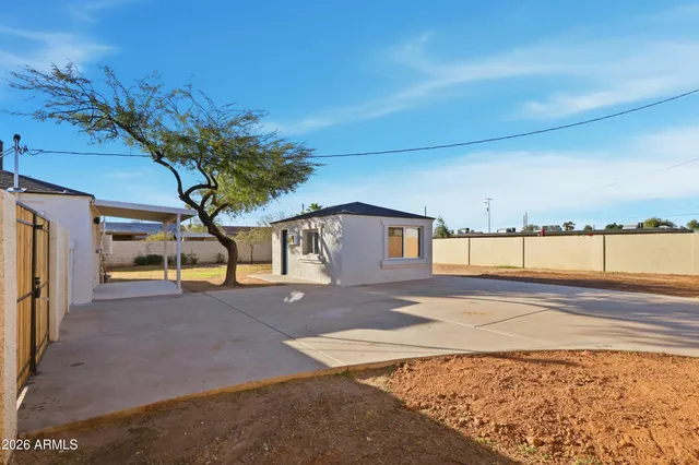 a view of a house with a yard and garage
