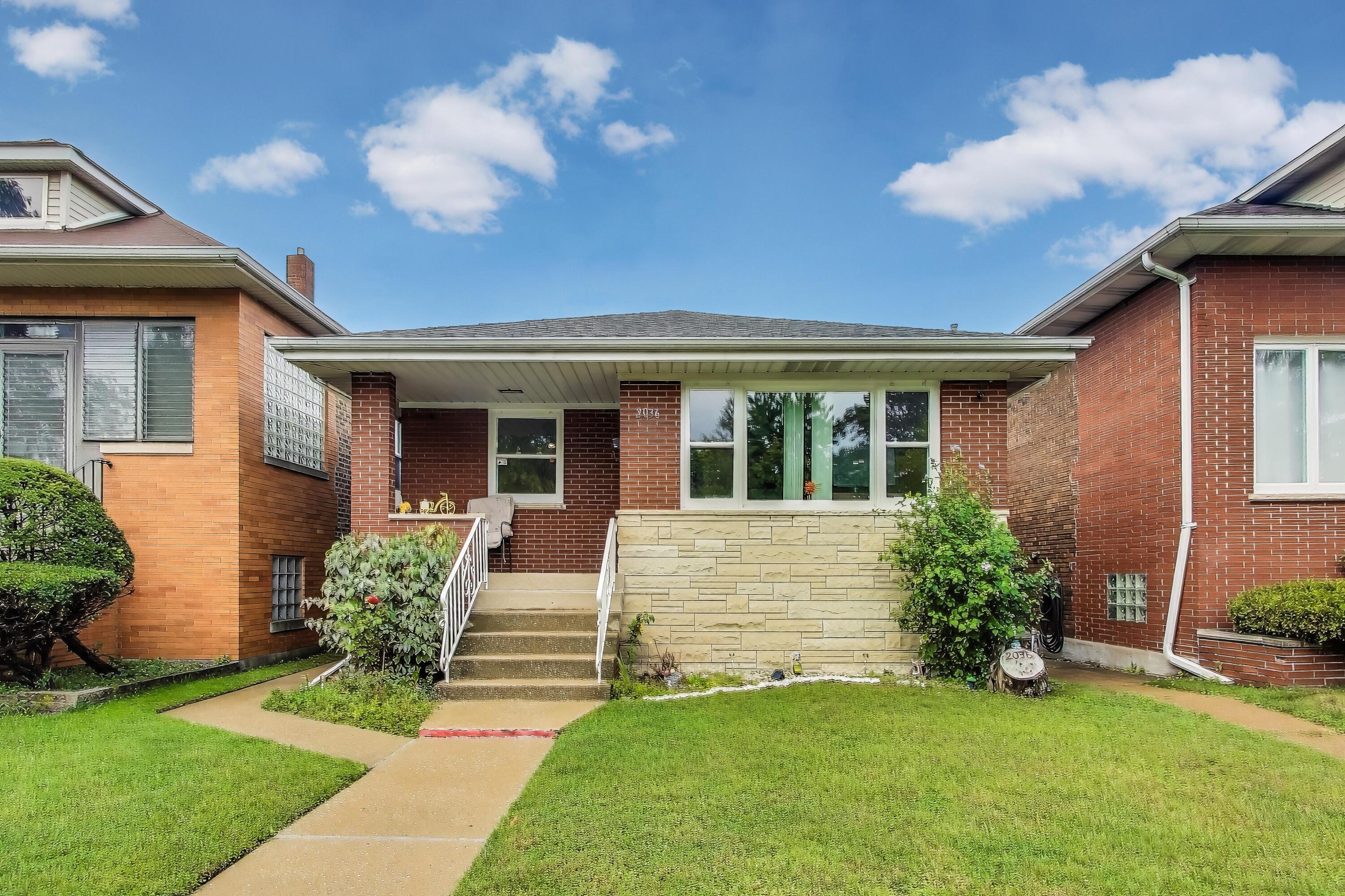 2036 Atchison Avenue Whiting, IN 46394 - Photo 1 of 30 a front view of a house with a garden