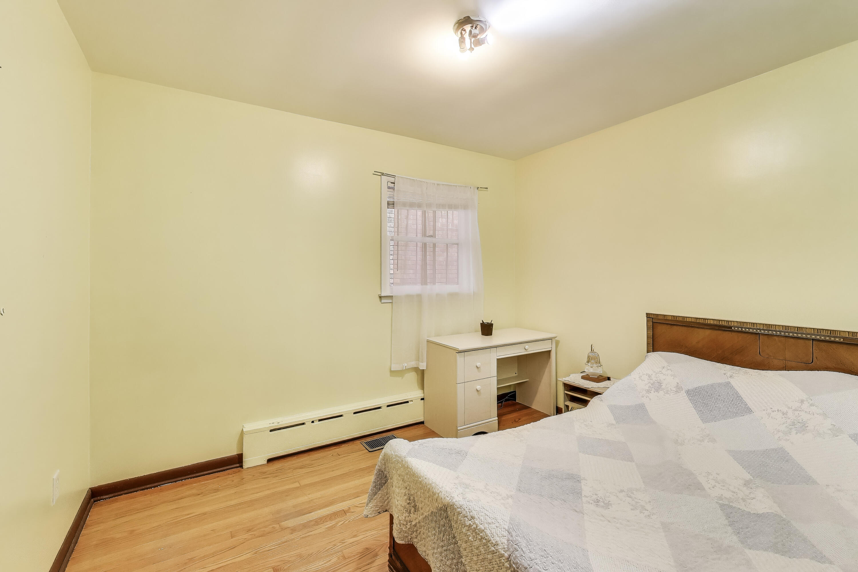 2036 Atchison Avenue Whiting, IN 46394 - Photo 14 of 30 a bedroom with a bed and a table in it