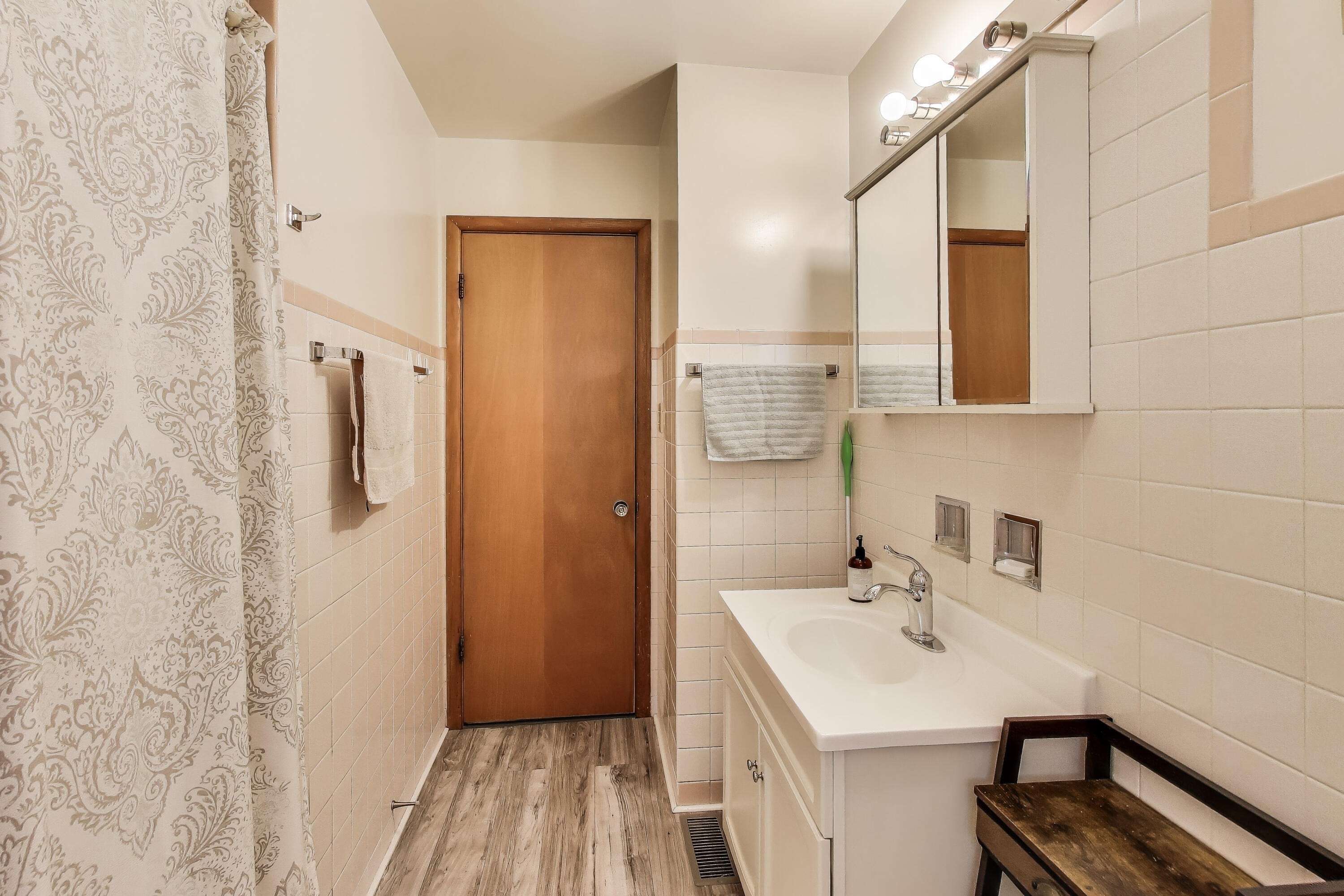 2036 Atchison Avenue Whiting, IN 46394 - Photo 16 of 30 a bathroom with a sink a mirror and shower
