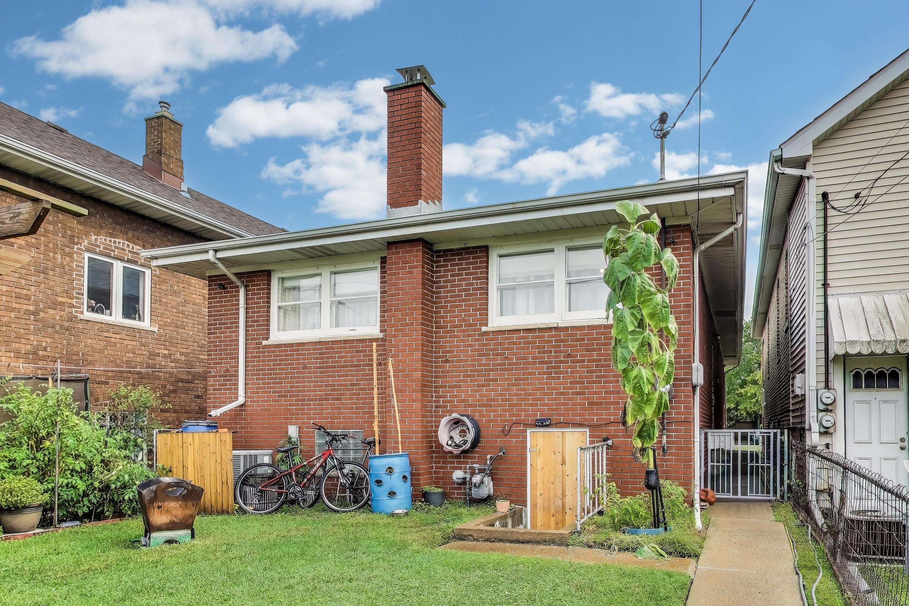 2036 Atchison Avenue Whiting, IN 46394 - Photo 24 of 30 a front view of a house with garden