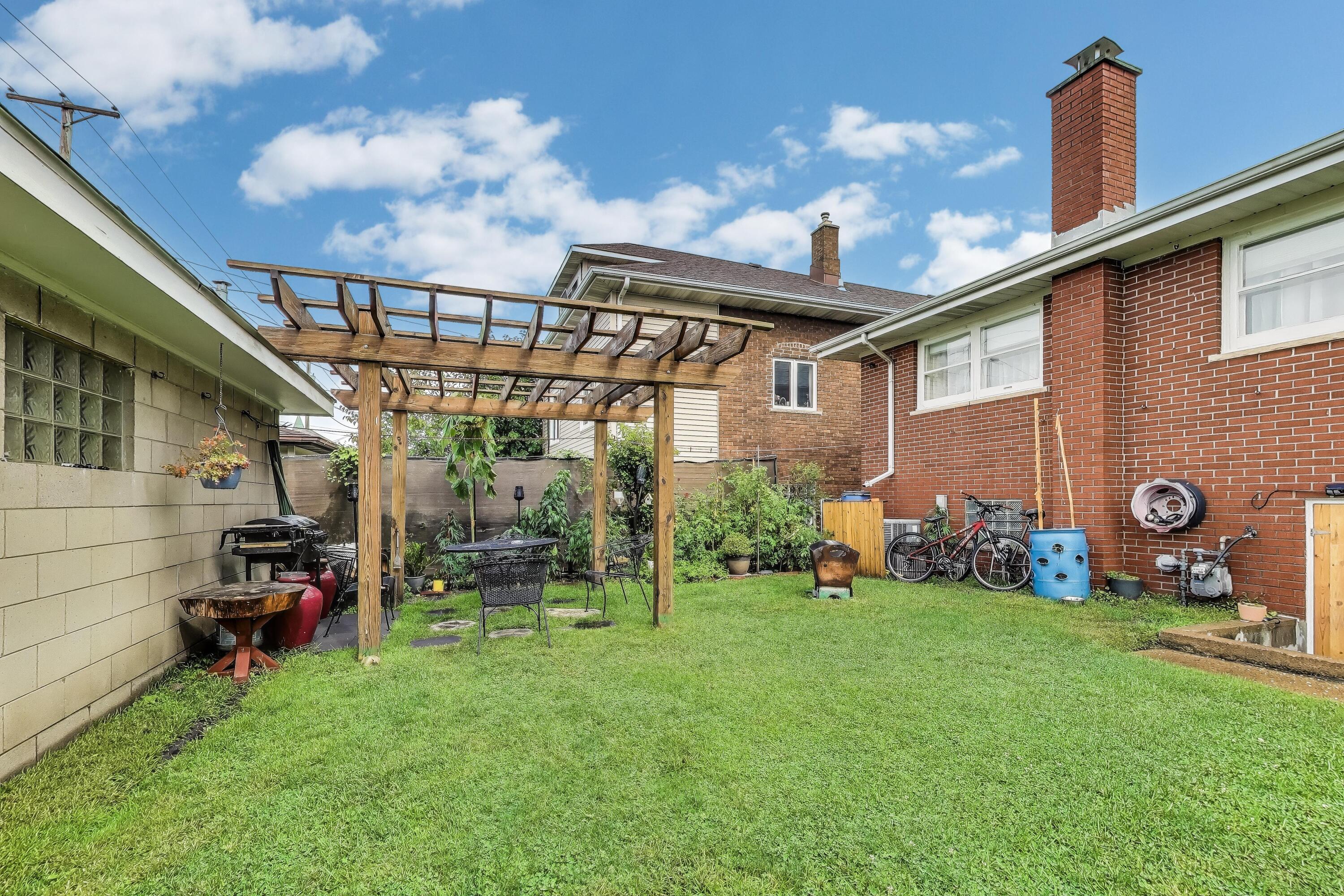 2036 Atchison Avenue Whiting, IN 46394 - Photo 26 of 30 a view of a chair and table in backyard of the house