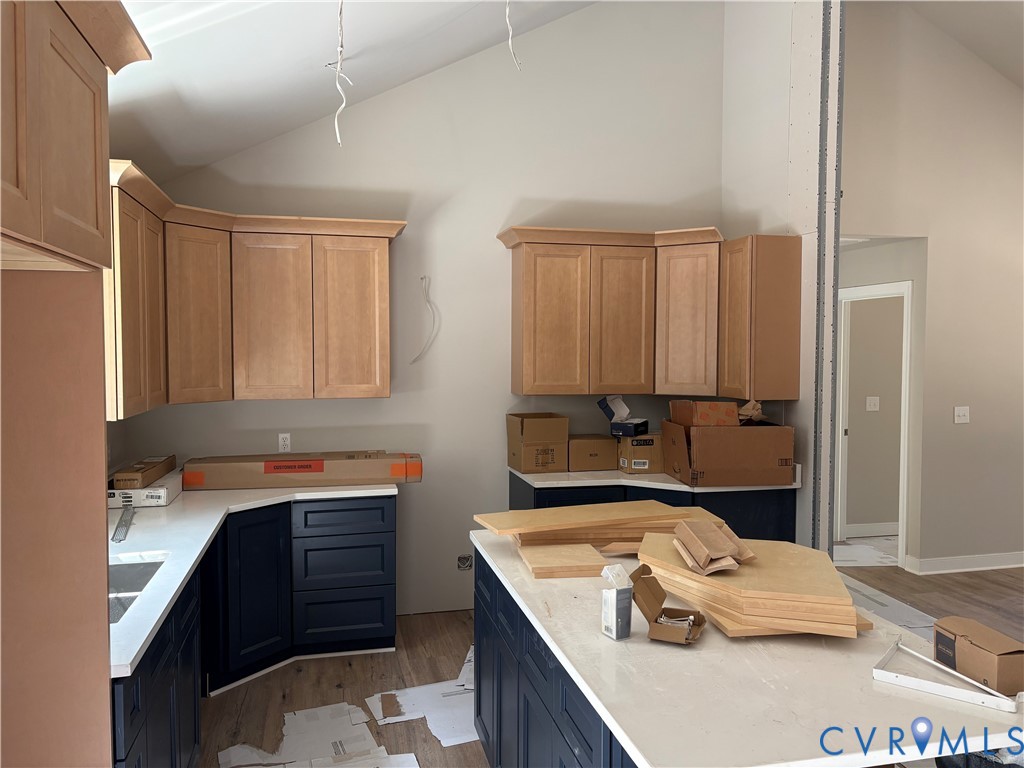 24178 Cabin Point Road Waverly, VA 23890 - Photo 4 of 14 a kitchen with a sink stove and cabinets