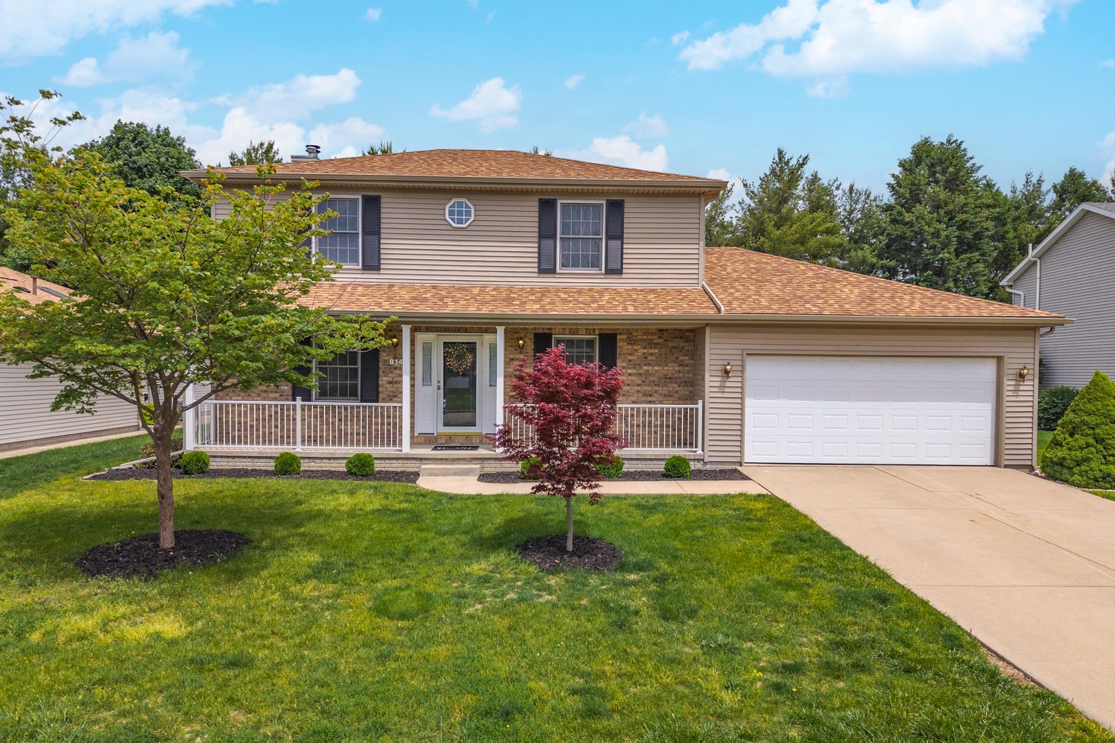 814 Landau Lane Normal, IL 61761 - Photo 48 of 58 a front view of a house with a yard and trees