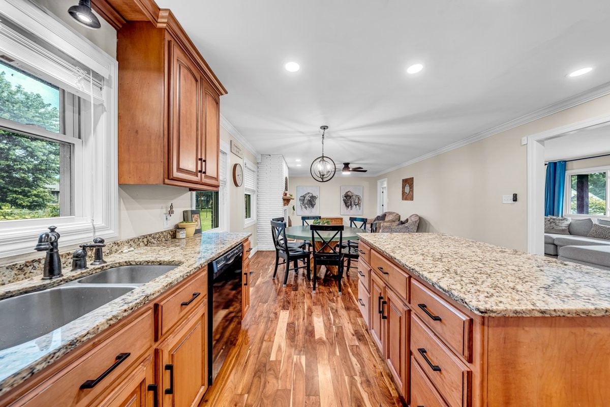 207 East Fort Street Tullahoma, TN 37388 - Photo 13 of 45 a kitchen with granite countertop sink stove and cabinets
