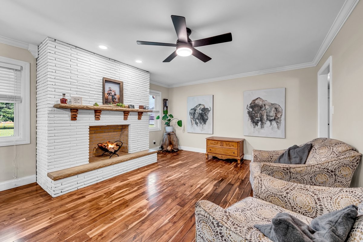 207 East Fort Street Tullahoma, TN 37388 - Photo 16 of 45 a living room with furniture and a fireplace