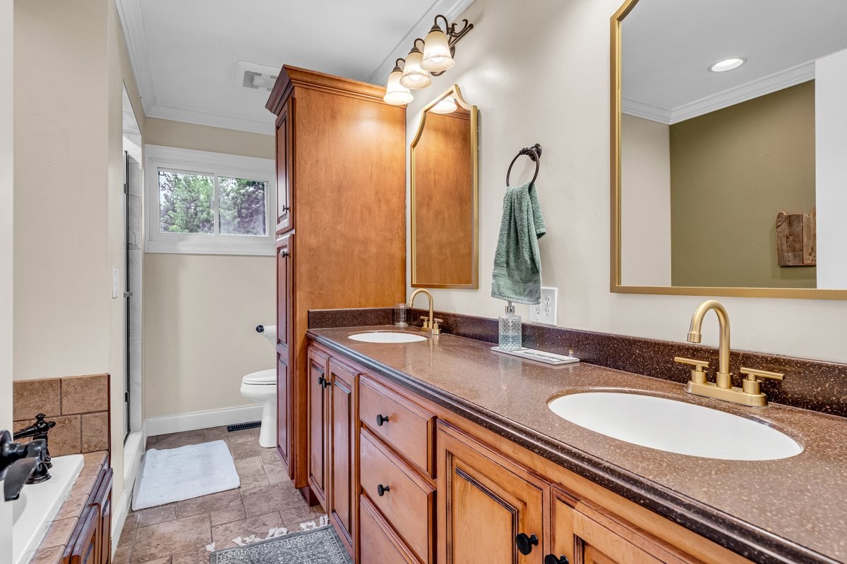 207 East Fort Street Tullahoma, TN 37388 - Photo 30 of 45 a bathroom with a double vanity sink and a mirror