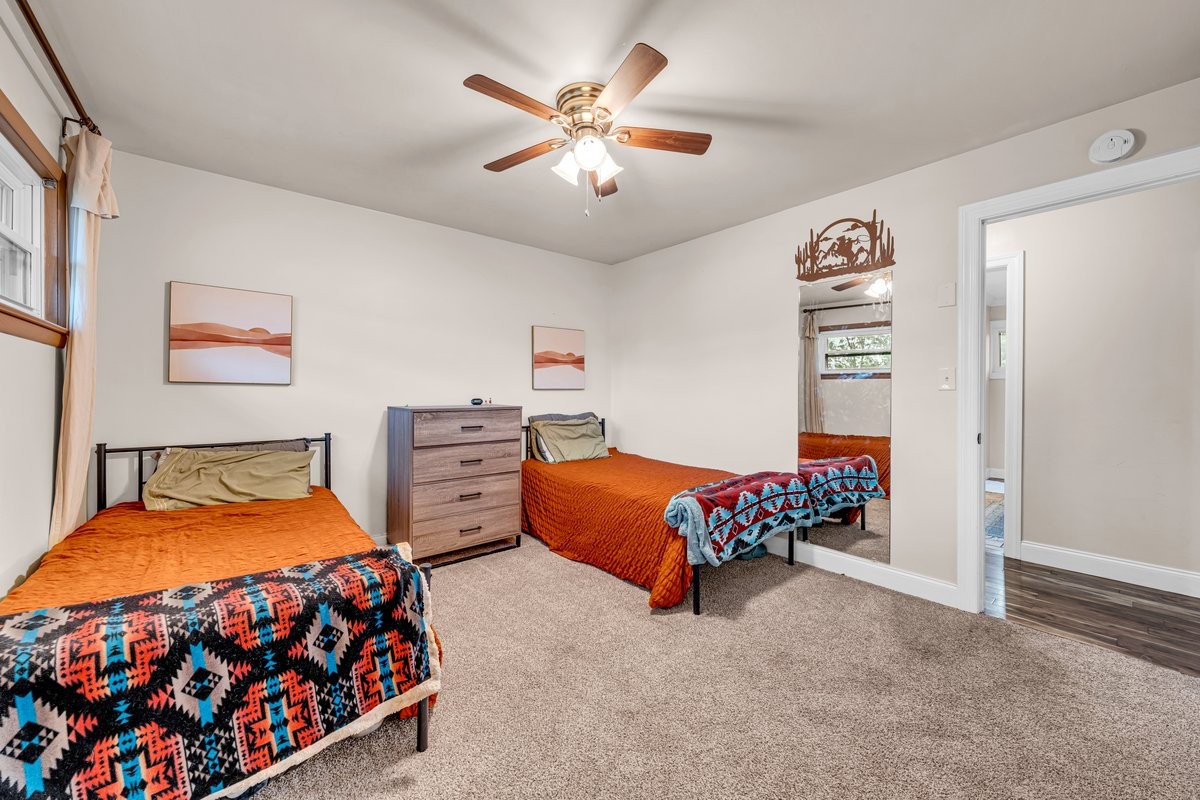 207 East Fort Street Tullahoma, TN 37388 - Photo 34 of 45 a bedroom with bed and paintings on the wall
