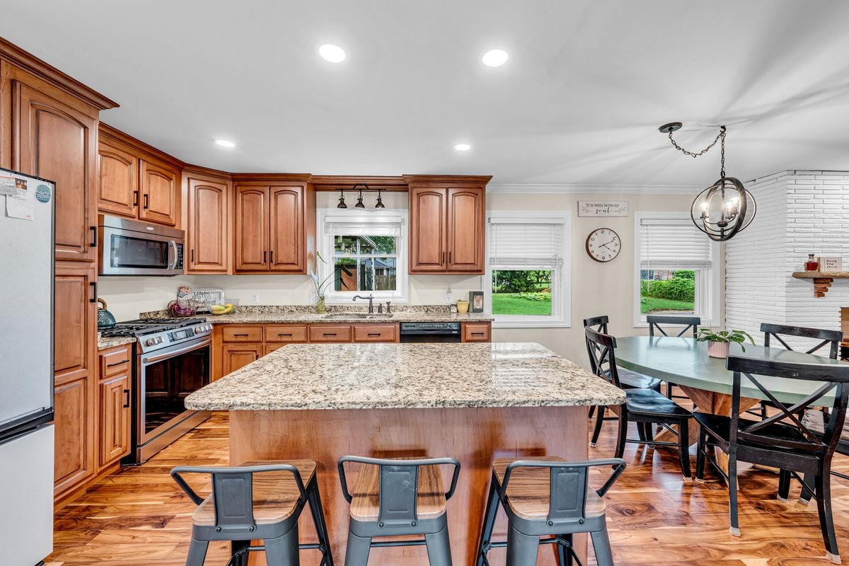 207 East Fort Street Tullahoma, TN 37388 - Photo 9 of 45 a large kitchen with a table and chairs in it