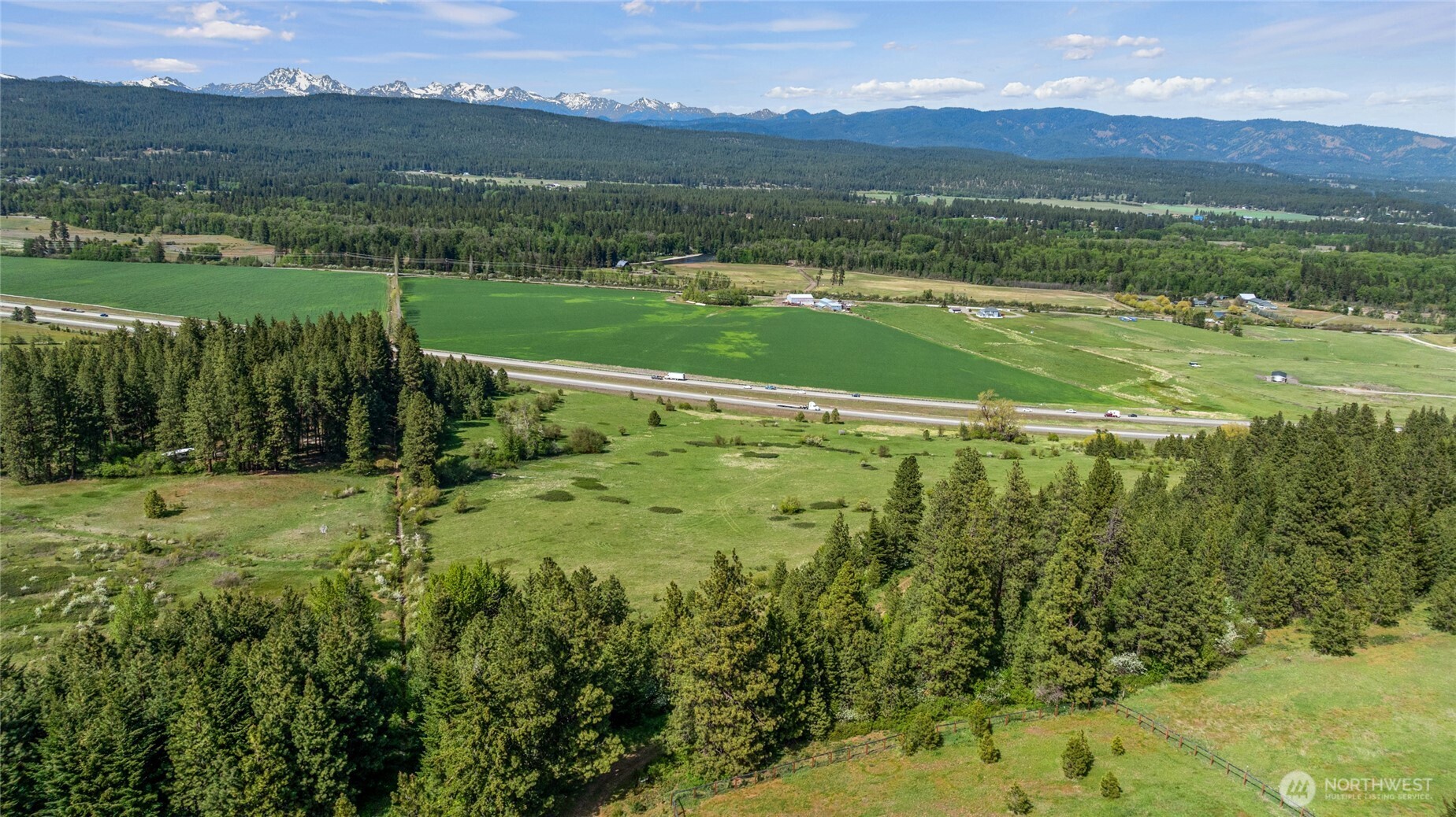 66-x3 Upper Peoh Point Road Cle Elum, WA 98922 - Photo 27 of 32 a view of a lush green hillside and houses