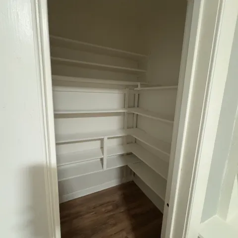 a kitchen with a cabinets and white stove