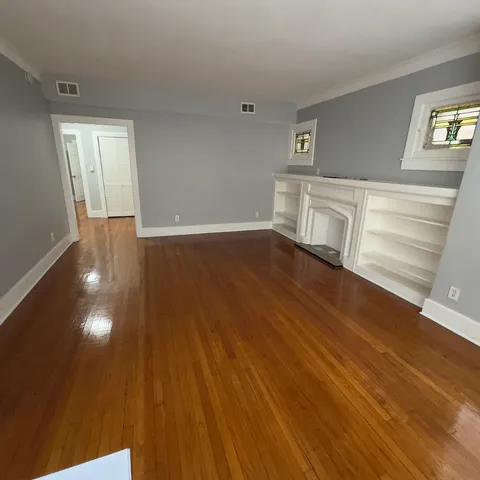 a view of a livingroom with wooden floor