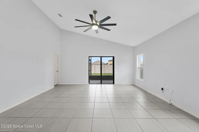 a view of a electric appliances and windows in a room