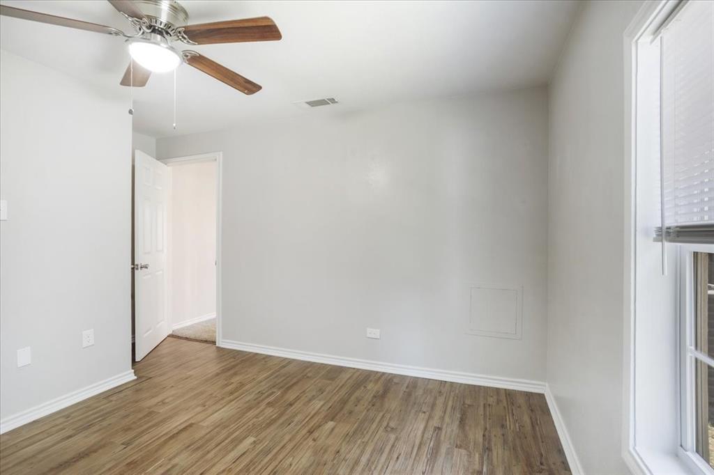 106 Cardinal Lane Pottsboro, TX 75076 - Photo 15 of 29 a view of an empty room with wooden floor