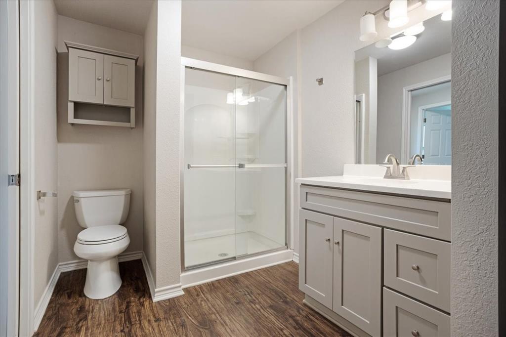 106 Cardinal Lane Pottsboro, TX 75076 - Photo 16 of 29 a bathroom with a sink toilet a mirror and shower