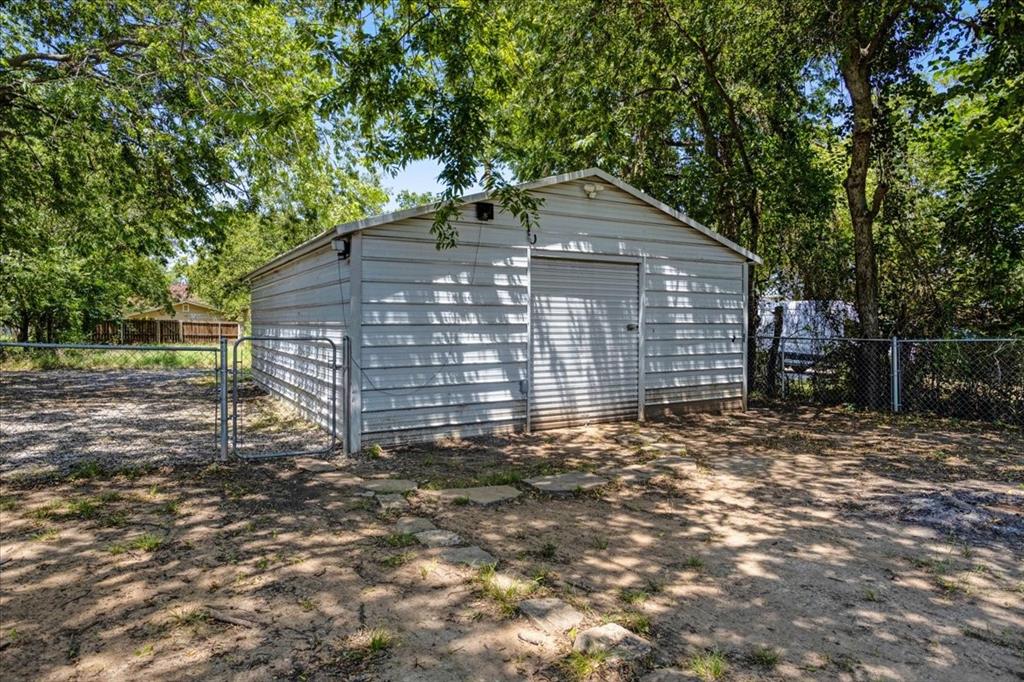 106 Cardinal Lane Pottsboro, TX 75076 - Photo 23 of 29 a view of a house with a yard and large tree