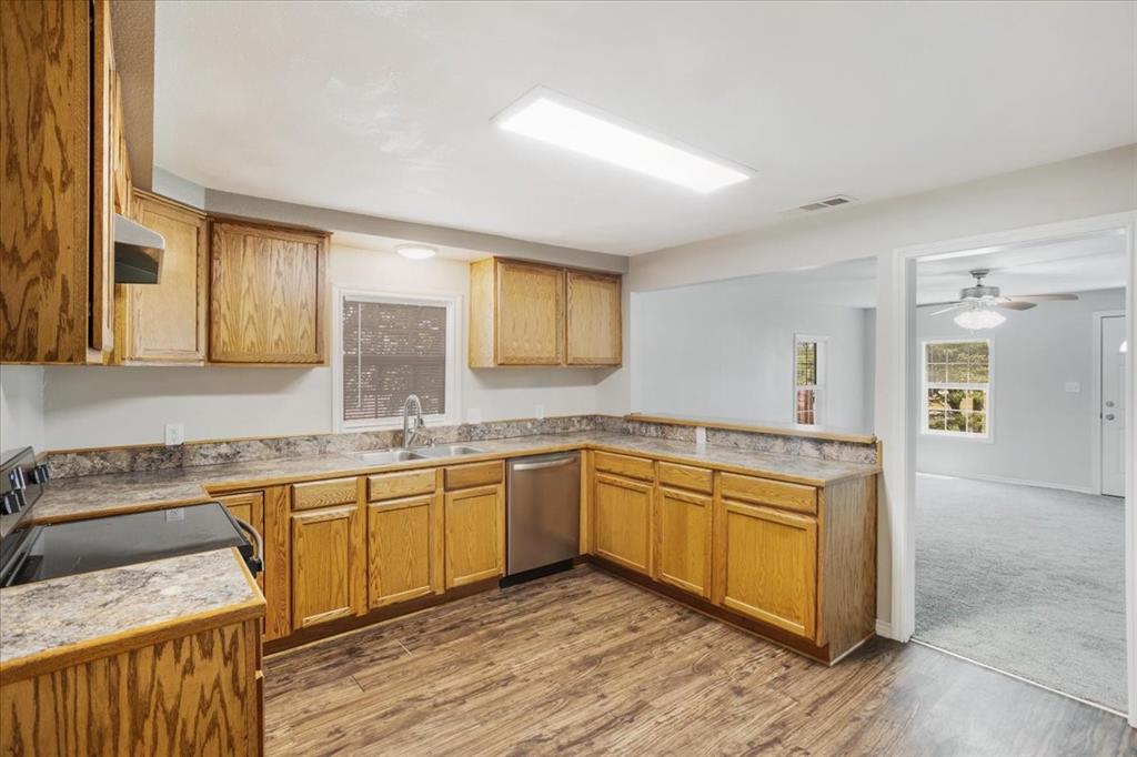 106 Cardinal Lane Pottsboro, TX 75076 - Photo 9 of 29 a kitchen with a sink and cabinets