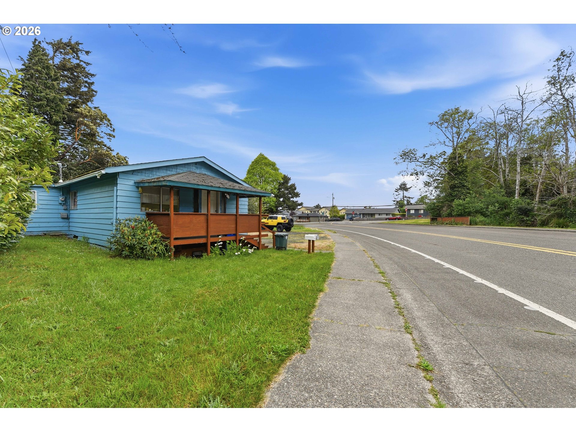 1955 Maple Street North Bend, OR 97459 - Photo 3 of 48 a view of a house with a yard