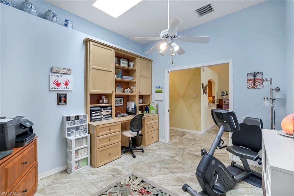 914 Augusta Boulevard, Unit 7 Naples, FL 34113 - Photo 20 of 32 Office area featuring arched walkways, baseboards, visible vents, and a ceiling fan