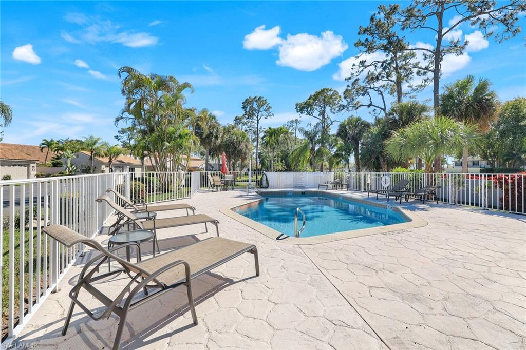 914 Augusta Boulevard, Unit 7 Naples, FL 34113 - Photo 30 of 32 Pool featuring fence and a patio