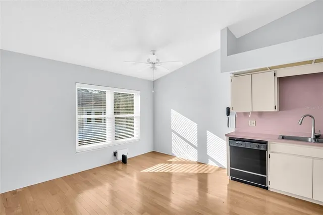 a bedroom with a bed dresser and a window