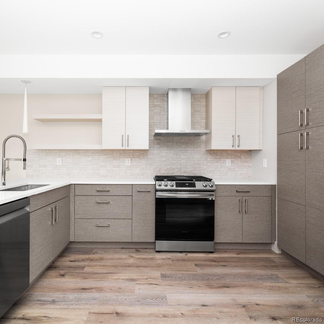 1318 Yates Street Denver, CO 80204 - Photo 2 of 14 a kitchen with stainless steel appliances granite countertop a stove and a sink