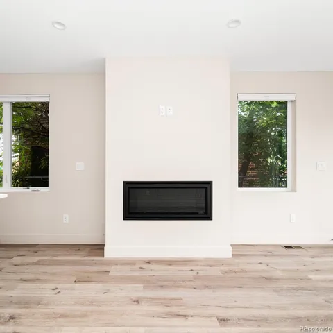 a view of a livingroom with wooden floor