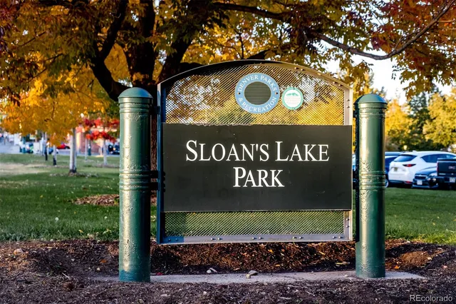 a sign board with a play ground