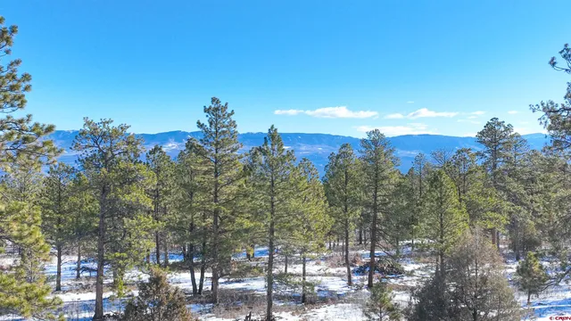 a view of mountain with lake view