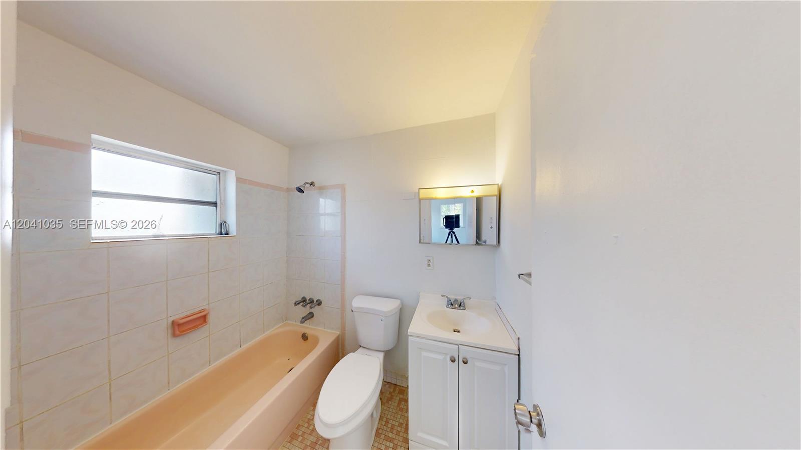6811 Southwest 16th Street Miami, FL 33144 - Photo 11 of 21 a bathroom with a sink and bathtub with toilet