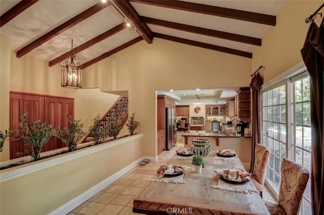 a view of a dining room with furniture wooden floor and a chandelier