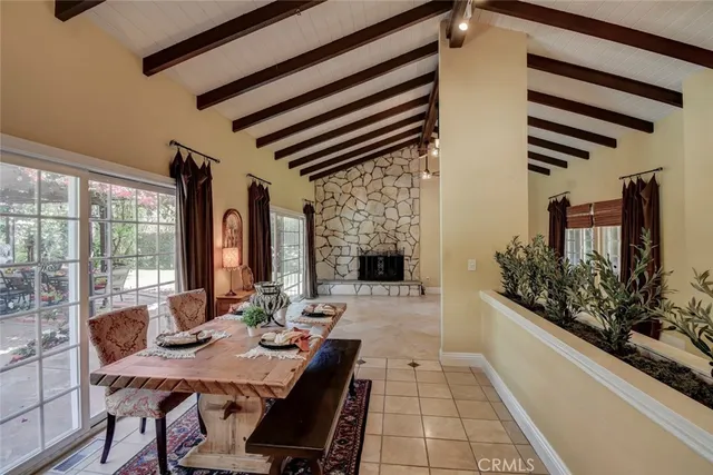 a kitchen with stainless steel appliances granite countertop a sink a stove counter space and a window